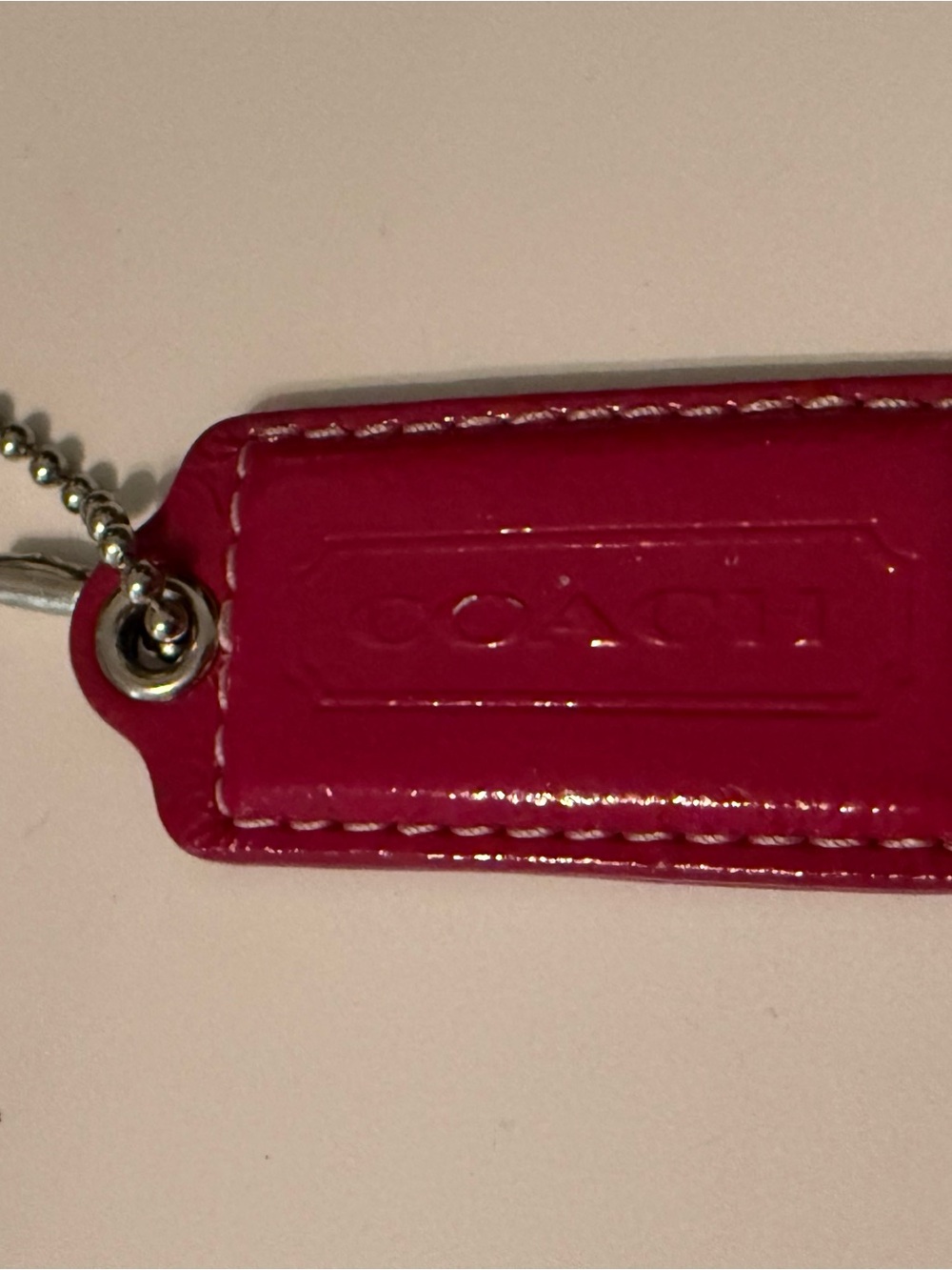 Coach Pink patent leather tag